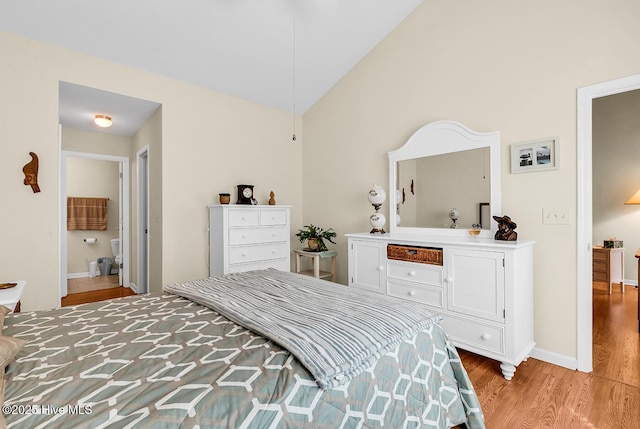 2129 Cass Lake Dr, Calabash, NC 28467 - bedroom with light wood-style flooring and vaulted ceiling