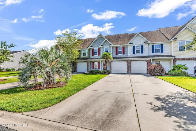 2129 Cass Lake Dr, Calabash, NC 28467 - multi unit property featuring a garage, concrete driveway, and a front lawn