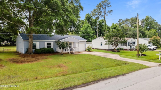 2402 S Lakeview Dr, Newport, NC 28570 - ranch-style home with concrete driveway, a garage, and a shingled roof