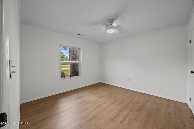 2402 S Lakeview Dr, Newport, NC 28570 - unfurnished room with wood finished floors and ceiling fan
