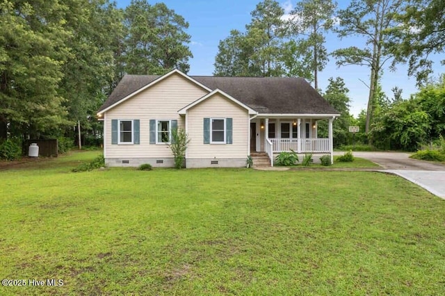 78 Clifford Rd, Red Springs, NC 28377 - single story home with crawl space, a porch, concrete driveway, and a front lawn