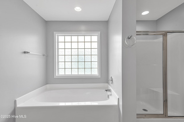 403 Grey Squirrel Ct, Jacksonville, NC 28540 - full bathroom with a stall shower, a garden tub, and recessed lighting