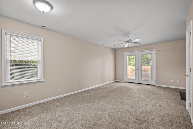 136 Lullwater Dr Unit B, Wilmington, NC 28403 - empty room featuring french doors, ceiling fan, and carpet flooring