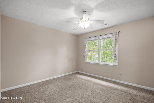 136 Lullwater Dr Unit B, Wilmington, NC 28403 - empty room with a textured ceiling, a ceiling fan, and carpet