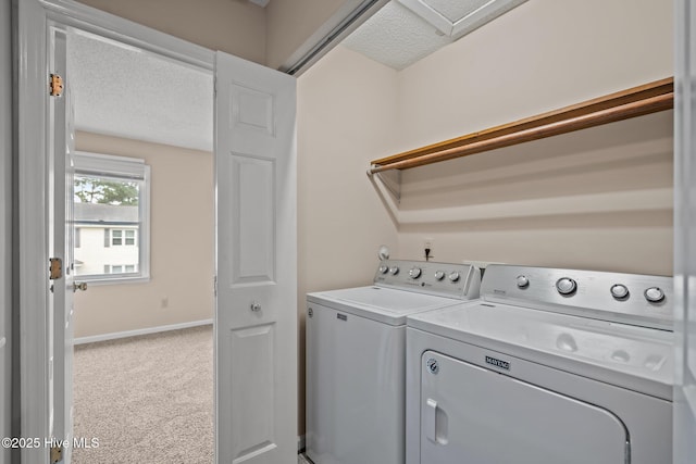 136 Lullwater Dr Unit B, Wilmington, NC 28403 - washroom with washer and clothes dryer, carpet flooring, and a textured ceiling