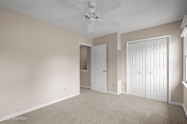 136 Lullwater Dr Unit B, Wilmington, NC 28403 - unfurnished bedroom featuring carpet, a closet, and ceiling fan