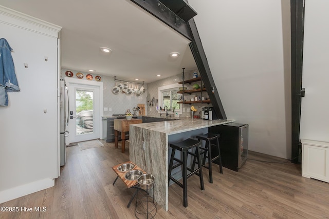 211 Fannie Creek Ln, Sneads Ferry, NC 28460 - bar area with refrigerator, light wood-style floors, and recessed lighting