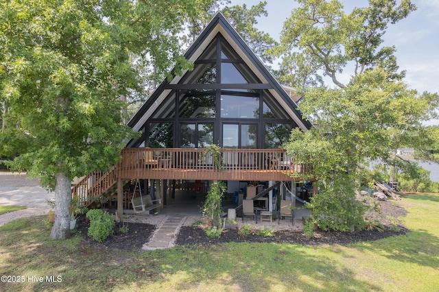 211 Fannie Creek Ln, Sneads Ferry, NC 28460 - rear view of house featuring stairs, a wooden deck, a patio, and a yard