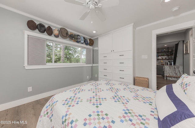 211 Fannie Creek Ln, Sneads Ferry, NC 28460 - bedroom featuring crown molding, wood finished floors, a ceiling fan, recessed lighting, and a closet