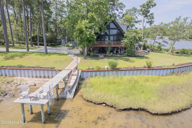 211 Fannie Creek Ln, Sneads Ferry, NC 28460 - back of property with stairs, a deck with water view, and a lawn