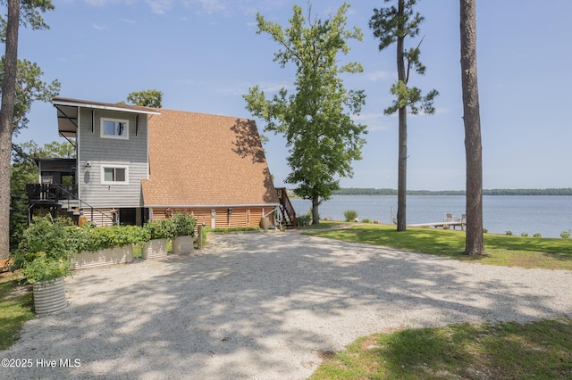 211 Fannie Creek Ln, Sneads Ferry, NC 28460 - view of side of home with stairs and a water view