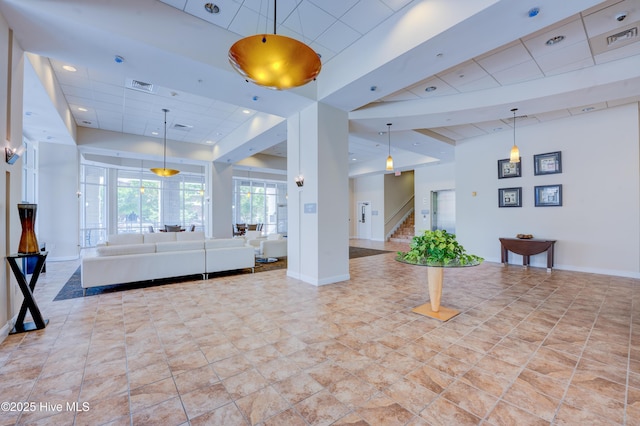 203 Sky Sail Blvd, New Bern, NC 28560 - living area featuring stairway, a paneled ceiling, and a raised ceiling