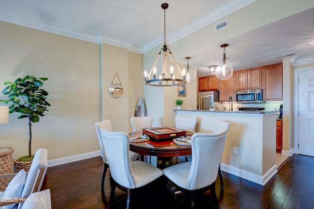 203 Sky Sail Blvd, New Bern, NC 28560 - dining space with dark wood finished floors, a chandelier, and ornamental molding