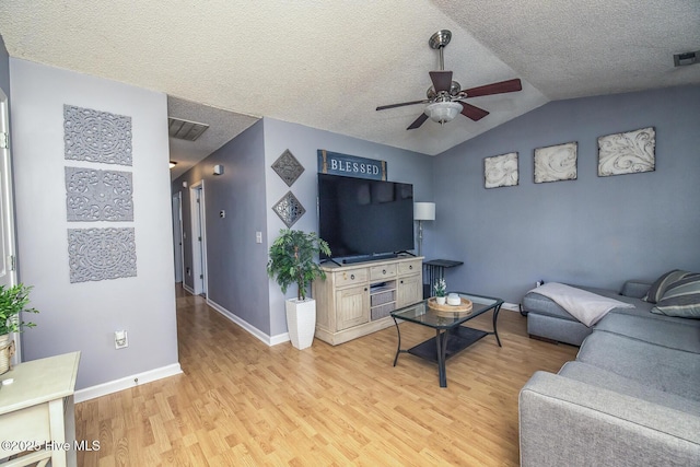 2505 Legend Dr, Wilmington, NC 28405 - living area featuring ceiling fan, light wood-type flooring, lofted ceiling, and a textured ceiling