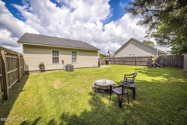 2505 Legend Dr, Wilmington, NC 28405 - rear view of house with a fire pit and a fenced backyard