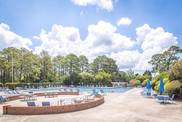 2505 Legend Dr, Wilmington, NC 28405 - community pool featuring view of wooded area and a patio area