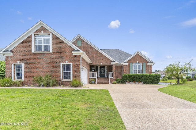 512 Shell Dr, Kure Beach, NC 28449 - traditional home with brick siding, a front yard, concrete driveway, a garage, and a porch