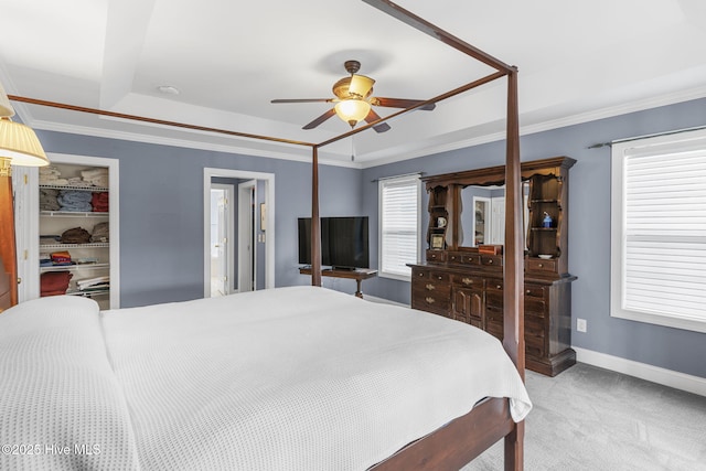 512 Shell Dr, Kure Beach, NC 28449 - bedroom featuring carpet, a walk in closet, a tray ceiling, a closet, and ceiling fan