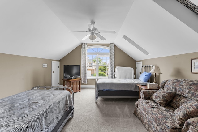 512 Shell Dr, Kure Beach, NC 28449 - carpeted bedroom with a skylight, a ceiling fan, and vaulted ceiling