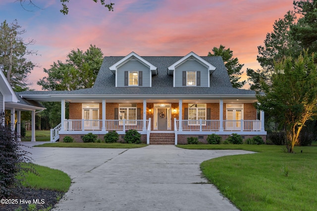 376 Red Fox Run Dr, Wallace, NC 28466 - view of front of home with a porch, a front yard, and brick siding