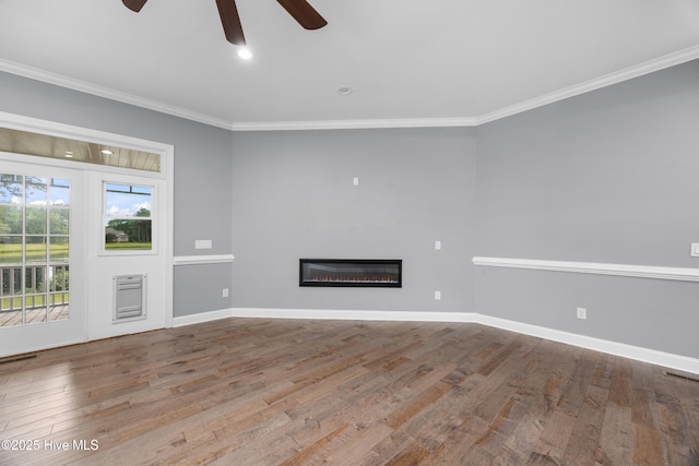 376 Red Fox Run Dr, Wallace, NC 28466 - unfurnished living room with a ceiling fan, wood finished floors, crown molding, and a glass covered fireplace