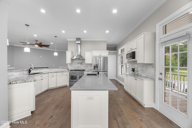 376 Red Fox Run Dr, Wallace, NC 28466 - kitchen featuring wall chimney range hood, stainless steel appliances, tasteful backsplash, recessed lighting, and crown molding