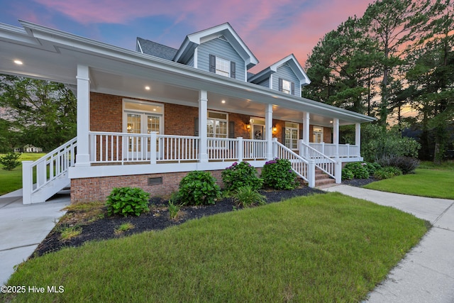 376 Red Fox Run Dr, Wallace, NC 28466 - view of front of property featuring a porch, a yard, brick siding, crawl space, and stairs