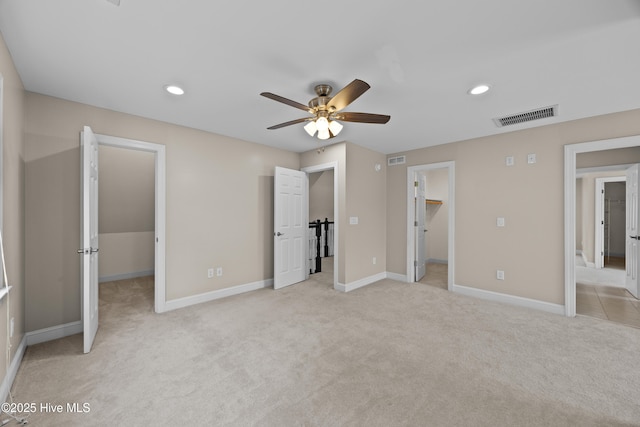 376 Red Fox Run Dr, Wallace, NC 28466 - unfurnished bedroom featuring a spacious closet, light carpet, recessed lighting, a closet, and ceiling fan