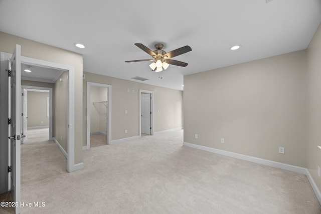376 Red Fox Run Dr, Wallace, NC 28466 - unfurnished bedroom featuring light colored carpet, recessed lighting, a walk in closet, ceiling fan, and a closet
