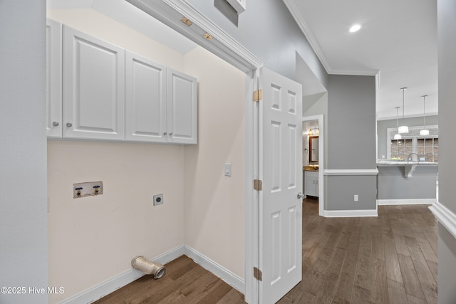 376 Red Fox Run Dr, Wallace, NC 28466 - laundry area with cabinet space, hookup for an electric dryer, dark wood-type flooring, washer hookup, and ornamental molding
