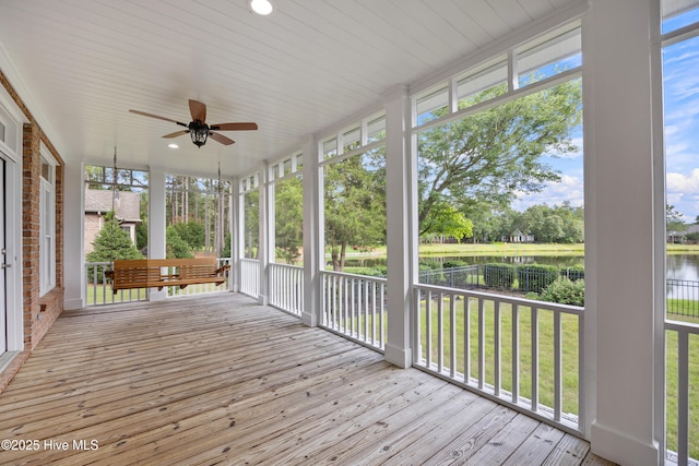376 Red Fox Run Dr, Wallace, NC 28466 - unfurnished sunroom with a water view, a ceiling fan, and plenty of natural light