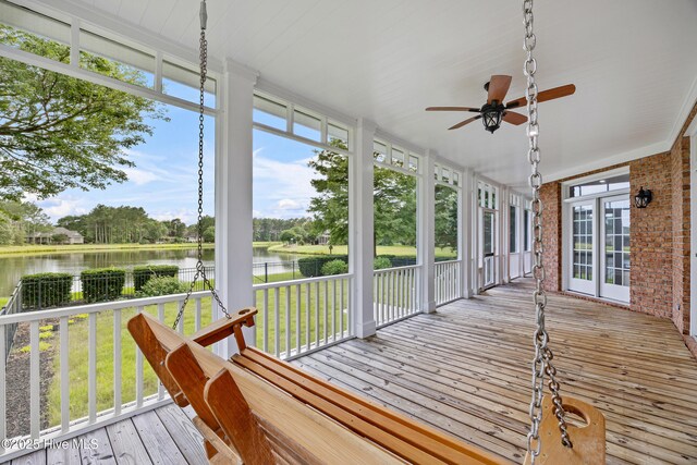 376 Red Fox Run Dr, Wallace, NC 28466 - wooden terrace featuring a water view, ceiling fan, and view of wooded area