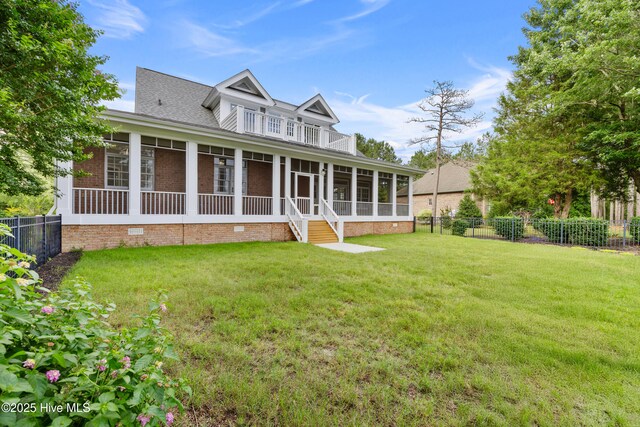 376 Red Fox Run Dr, Wallace, NC 28466 - back of house with a sunroom, crawl space, a fenced backyard, and brick siding