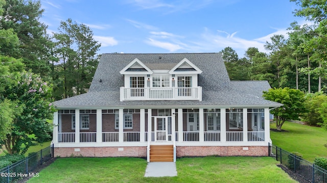 376 Red Fox Run Dr, Wallace, NC 28466 - view of front of house with a balcony, crawl space, a shingled roof, and a fenced backyard