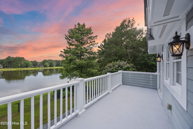 376 Red Fox Run Dr, Wallace, NC 28466 - balcony at dusk with a water view and view of wooded area