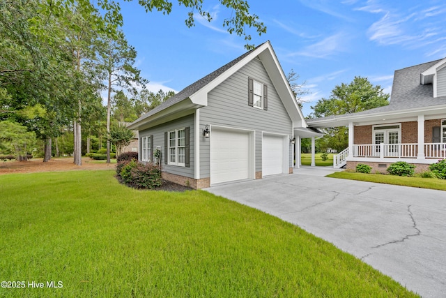 376 Red Fox Run Dr, Wallace, NC 28466 - view of home's exterior featuring a yard, an attached garage, concrete driveway, and a porch