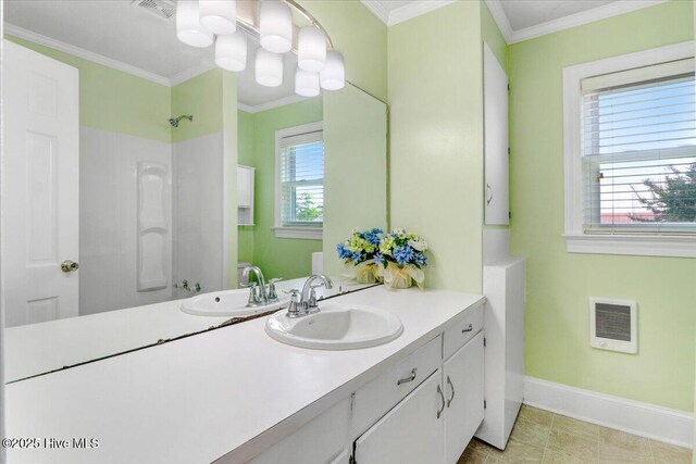 102 SE Third St, Snow Hill, NC 28580 - bathroom with heating unit, vanity, and crown molding