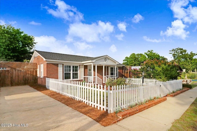 102 SE Third St, Snow Hill, NC 28580 - view of front of property with brick siding, covered porch, and a fenced front yard