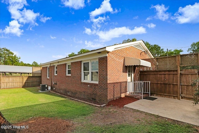 102 SE Third St, Snow Hill, NC 28580 - rear view of property with crawl space, a fenced backyard, brick siding, and a patio