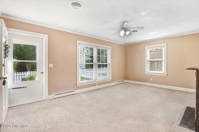 102 SE Third St, Snow Hill, NC 28580 - carpeted empty room featuring a baseboard heating unit, crown molding, and ceiling fan