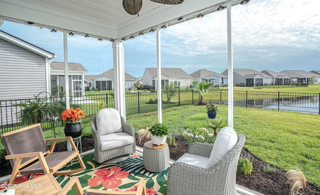 9363 Eagle Ridge Dr, Calabash, NC 28467 - sunroom with a residential view, ceiling fan, and a water view