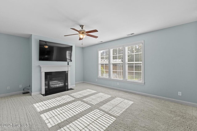 109 Creek End Ct, Swansboro, NC 28584 - unfurnished living room with carpet floors, a fireplace with flush hearth, and ceiling fan