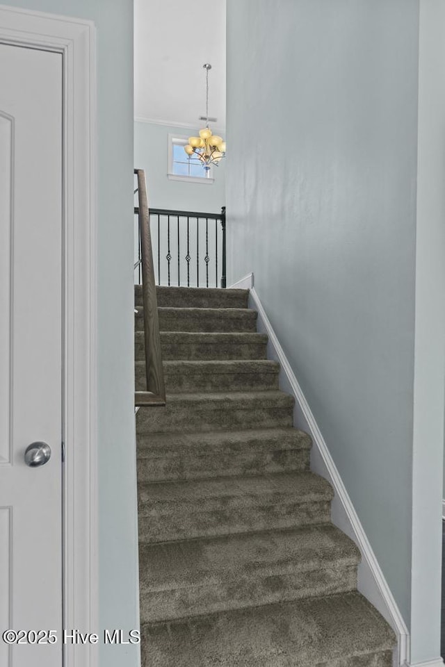 109 Creek End Ct, Swansboro, NC 28584 - stairs with a chandelier and baseboards