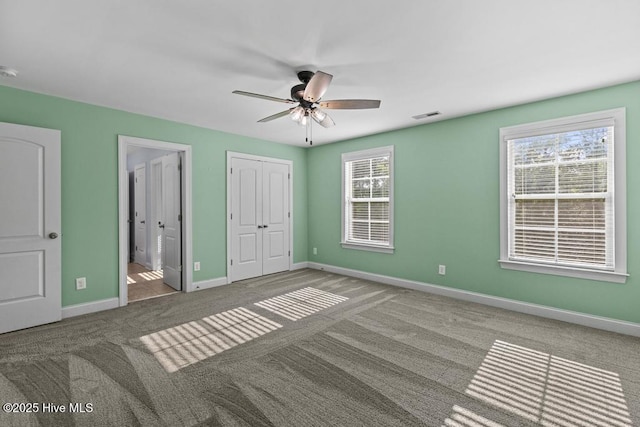 109 Creek End Ct, Swansboro, NC 28584 - unfurnished bedroom with carpet floors, ensuite bath, and a ceiling fan