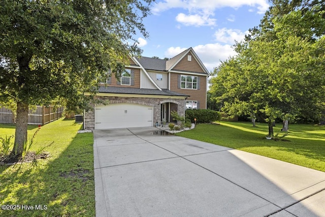 109 Creek End Ct, Swansboro, NC 28584 - view of front of house with concrete driveway, an attached garage, and stone siding