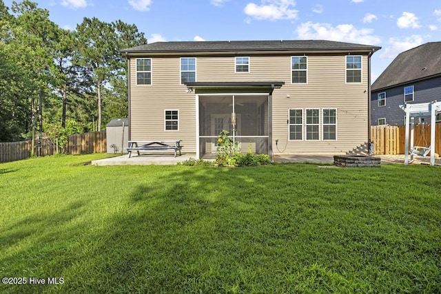 109 Creek End Ct, Swansboro, NC 28584 - rear view of house featuring a patio, a fire pit, a sunroom, and a fenced backyard