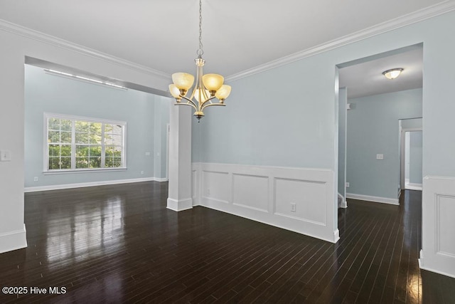 109 Creek End Ct, Swansboro, NC 28584 - empty room featuring a chandelier, ornamental molding, wood finished floors, and a wainscoted wall