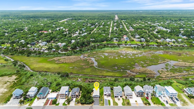 316 E Dolphin Dr, Oak Island, NC 28465 - aerial overview of property's location featuring nearby suburban area and a large body of water