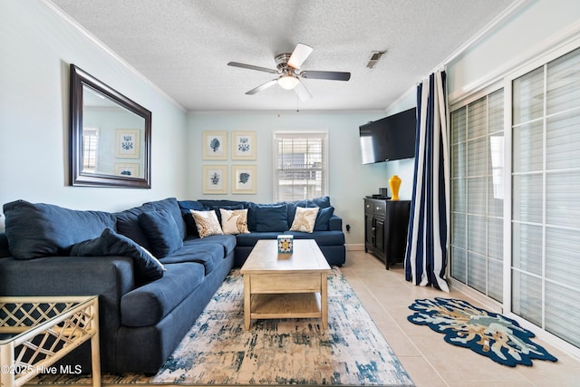 316 E Dolphin Dr, Oak Island, NC 28465 - living room featuring ceiling fan, light tile patterned floors, crown molding, and a textured ceiling