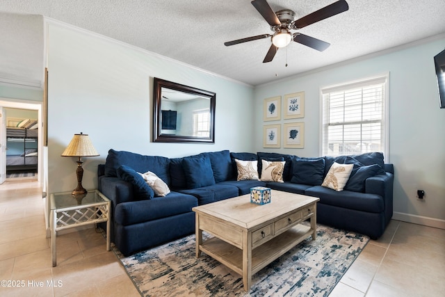 316 E Dolphin Dr, Oak Island, NC 28465 - living area with light tile patterned floors, ornamental molding, a ceiling fan, and a textured ceiling